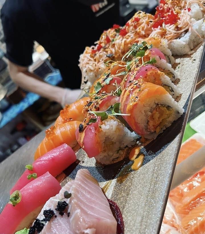 Fresh sashimi and sushi rolls plated at Nori