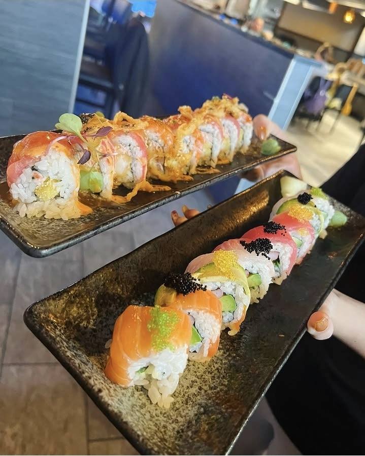 Two signature rolls topped with fish roe and crispy shallots